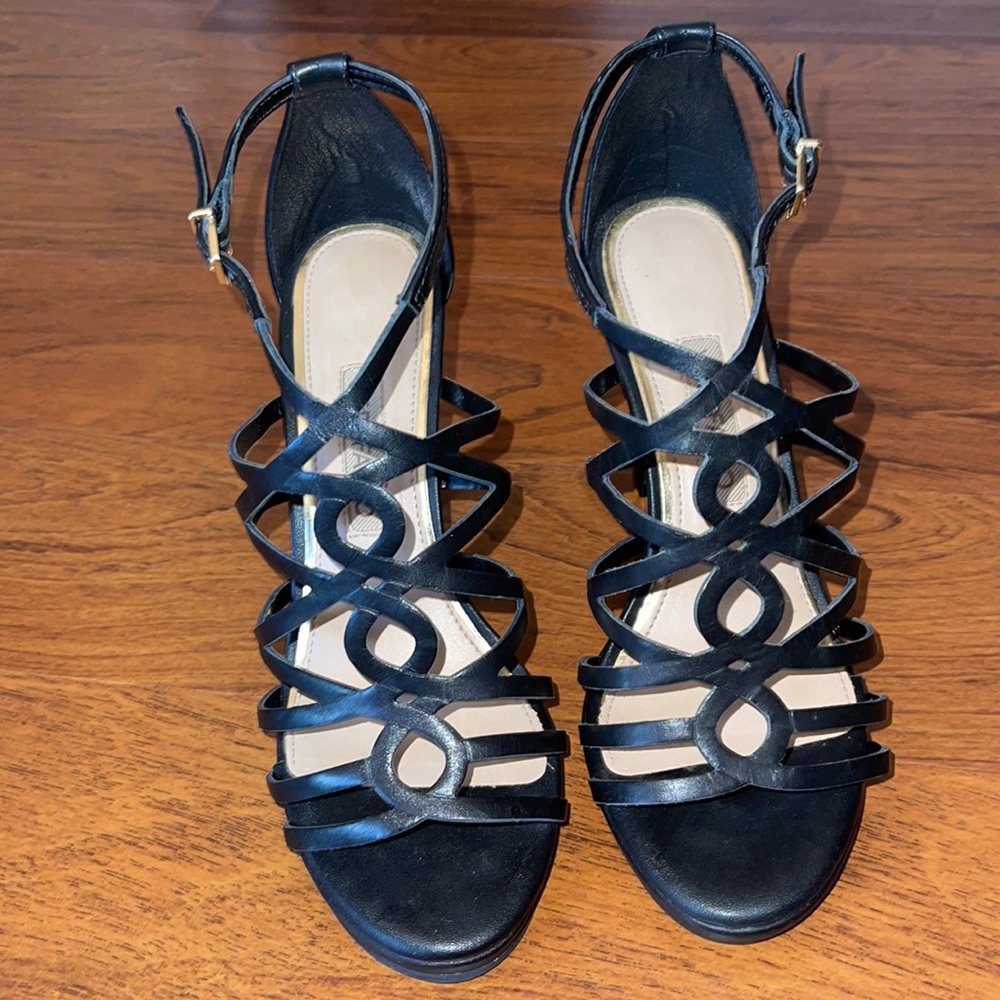 Black sandal heel with a little platform.